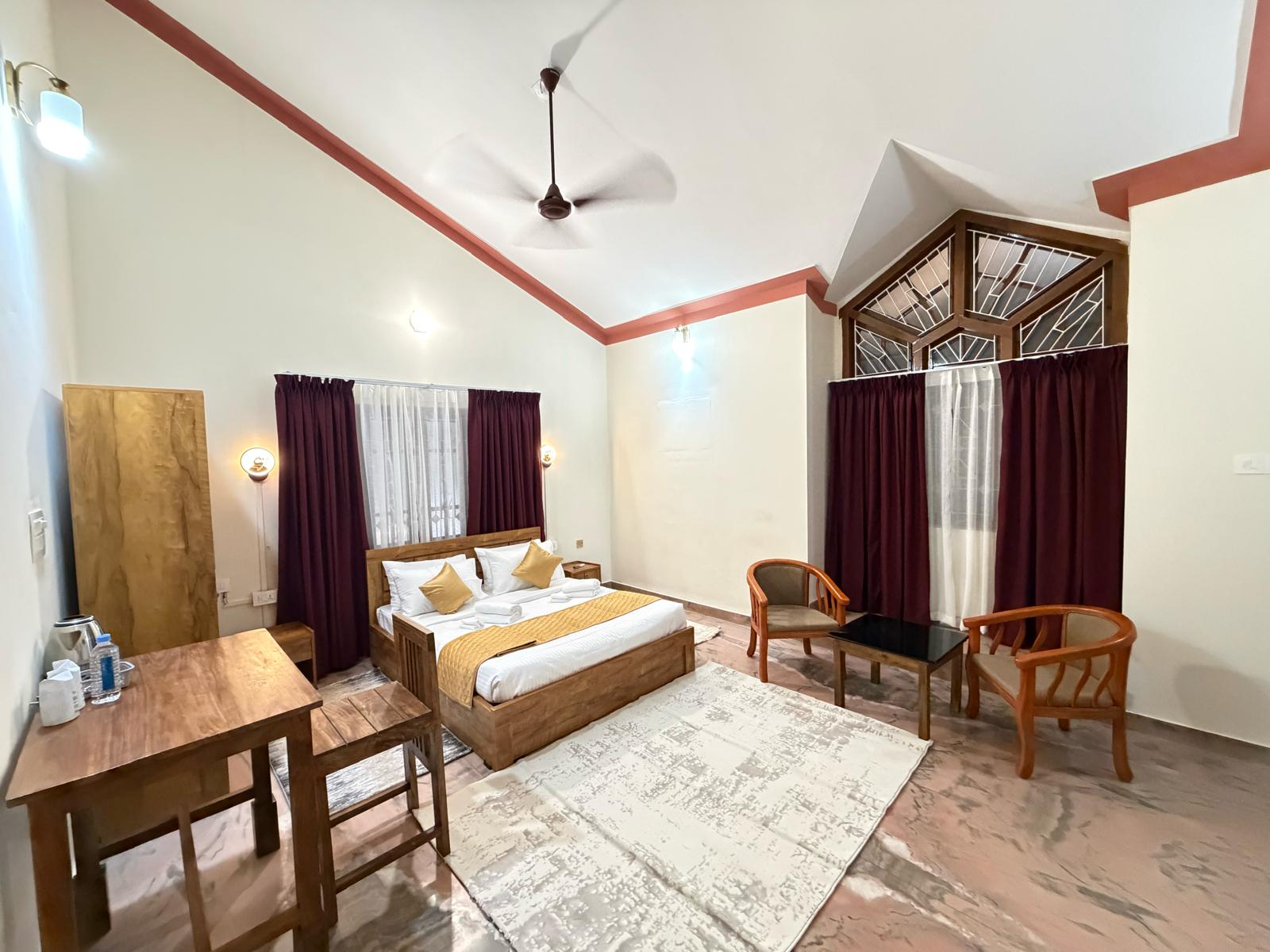 Royal Suite at Bloom Fort Villa with king bed and golden accents
